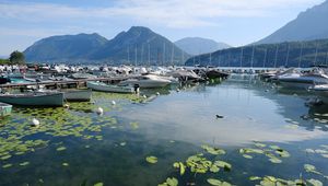 Preview wallpaper lake, pier, boats, mountains, water lilies, nature