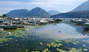 Preview wallpaper lake, pier, boats, mountains, water lilies, nature