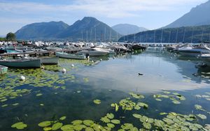 Preview wallpaper lake, pier, boats, mountains, water lilies, nature