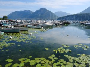 Preview wallpaper lake, pier, boats, mountains, water lilies, nature