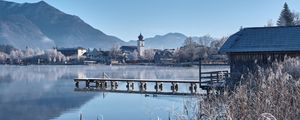 Preview wallpaper lake, pier, buildings, mountains, shore