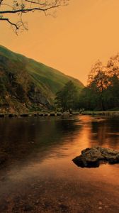 Preview wallpaper lake, pond, stones, trees, twilight, grass, evening