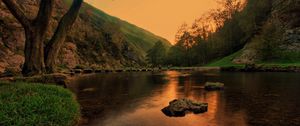 Preview wallpaper lake, pond, stones, trees, twilight, grass, evening