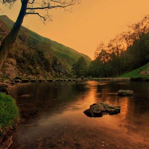 Preview wallpaper lake, pond, stones, trees, twilight, grass, evening