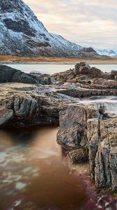 Preview wallpaper lake, rocks, mountains, snow, snowy