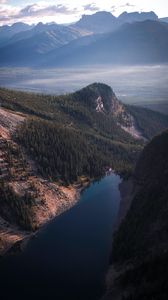 Preview wallpaper lake, rocks, slope, peaks, fog