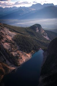 Preview wallpaper lake, rocks, slope, peaks, fog