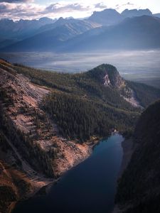 Preview wallpaper lake, rocks, slope, peaks, fog