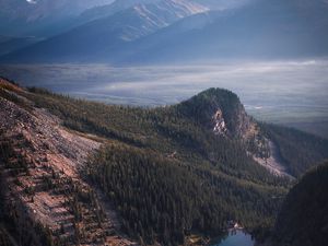 Preview wallpaper lake, rocks, slope, peaks, fog