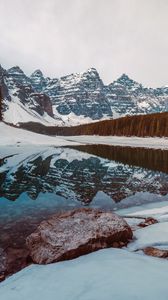 Preview wallpaper lake, rocks, stones, snow, snowy