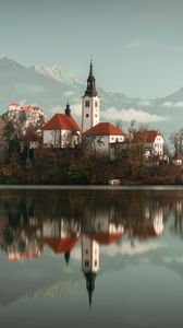 Preview wallpaper lake, shore, buildings, mountains, forest, water