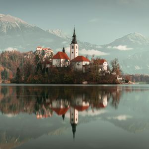 Preview wallpaper lake, shore, buildings, mountains, forest, water