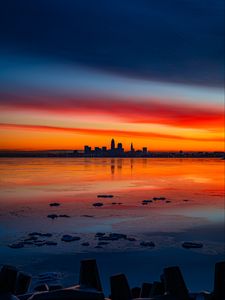 Preview wallpaper lake, shore, city, buildings, sunset, dusk, dark