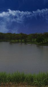 Preview wallpaper lake, shore, grass, trees, sky, clouds, water, nature