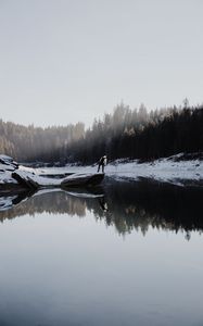 Preview wallpaper lake, silhouette, stone, snow, trees, reflection