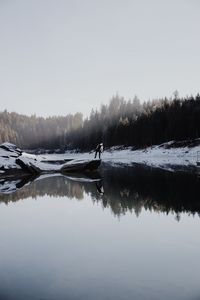 Preview wallpaper lake, silhouette, stone, snow, trees, reflection