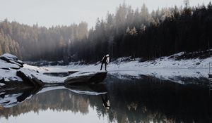 Preview wallpaper lake, silhouette, stone, snow, trees, reflection