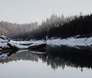 Preview wallpaper lake, silhouette, stone, snow, trees, reflection