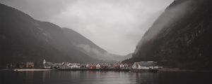 Preview wallpaper lake, slope, houses, fog, sky