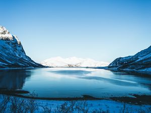 Preview wallpaper lake, snow, mountains, sky, trees, coast, winter