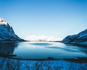 Preview wallpaper lake, snow, mountains, sky, trees, coast, winter