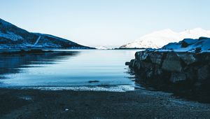 Preview wallpaper lake, snow, mountains, sky, winter, sand, shore