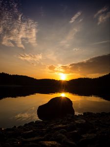 Preview wallpaper lake, stone, sunset, reflection, sun, sky, forest, coast