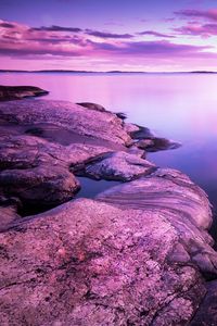 Preview wallpaper lake, stones, landscape, shore, clouds, purple