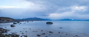 Preview wallpaper lake, stones, mountains, horizon, clouds