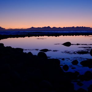 Preview wallpaper lake, stones, reflection, twilight, dark