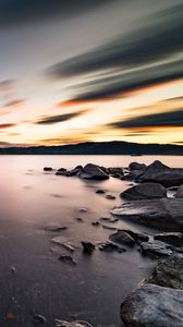 Preview wallpaper lake, stones, rocks, water, sunset, landscape