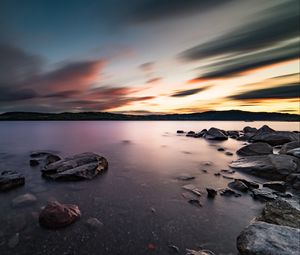 Preview wallpaper lake, stones, rocks, water, sunset, landscape