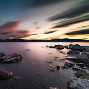 Preview wallpaper lake, stones, rocks, water, sunset, landscape