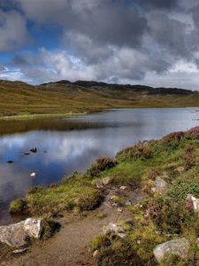 Preview wallpaper lake, stones, sky, scotland, bad weather