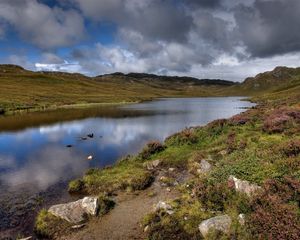 Preview wallpaper lake, stones, sky, scotland, bad weather