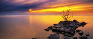 Preview wallpaper lake, stones, sunset, water, reflection, tree