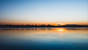 Preview wallpaper lake, sunset, horizon, distant, twilight, clear sky