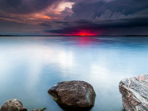 Preview wallpaper lake, sunset, landscape, water, stones, horizon