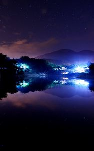 Preview wallpaper lake, town, stars, lights, home, night