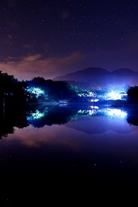 Preview wallpaper lake, town, stars, lights, home, night