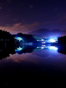 Preview wallpaper lake, town, stars, lights, home, night