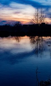 Preview wallpaper lake, trees, silhouettes, sunset, clouds, nature, dark