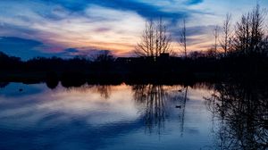 Preview wallpaper lake, trees, silhouettes, sunset, clouds, nature, dark