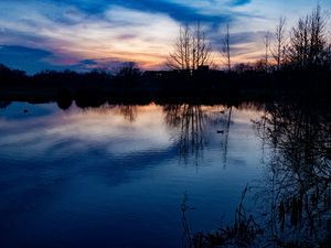 Preview wallpaper lake, trees, silhouettes, sunset, clouds, nature, dark