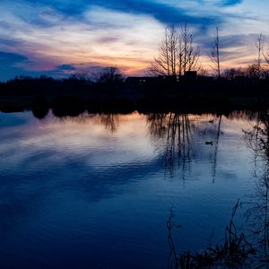 Preview wallpaper lake, trees, silhouettes, sunset, clouds, nature, dark