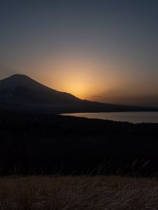 Preview wallpaper lake, volcano, grass, nature, dark