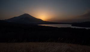Preview wallpaper lake, volcano, grass, nature, dark