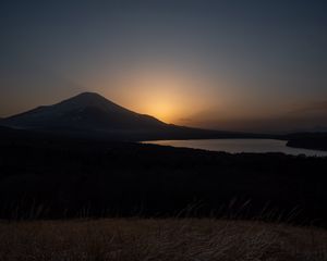 Preview wallpaper lake, volcano, grass, nature, dark