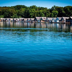 Preview wallpaper lake, water, houses, roofs, trees