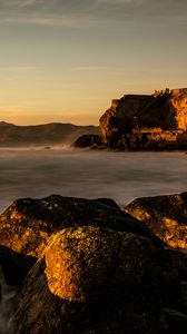 Preview wallpaper lake, water, rocks, stones, sunset, nature, landscape